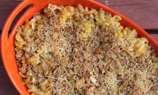 Shrimp macaroni and cheese with granola topping.
