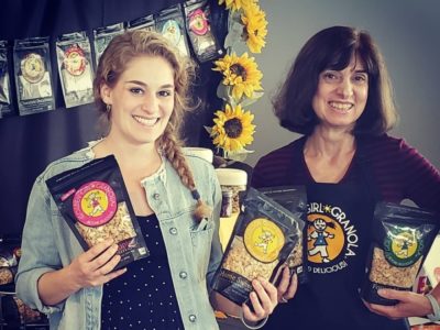 Deborah and Jacquie display granola flavors